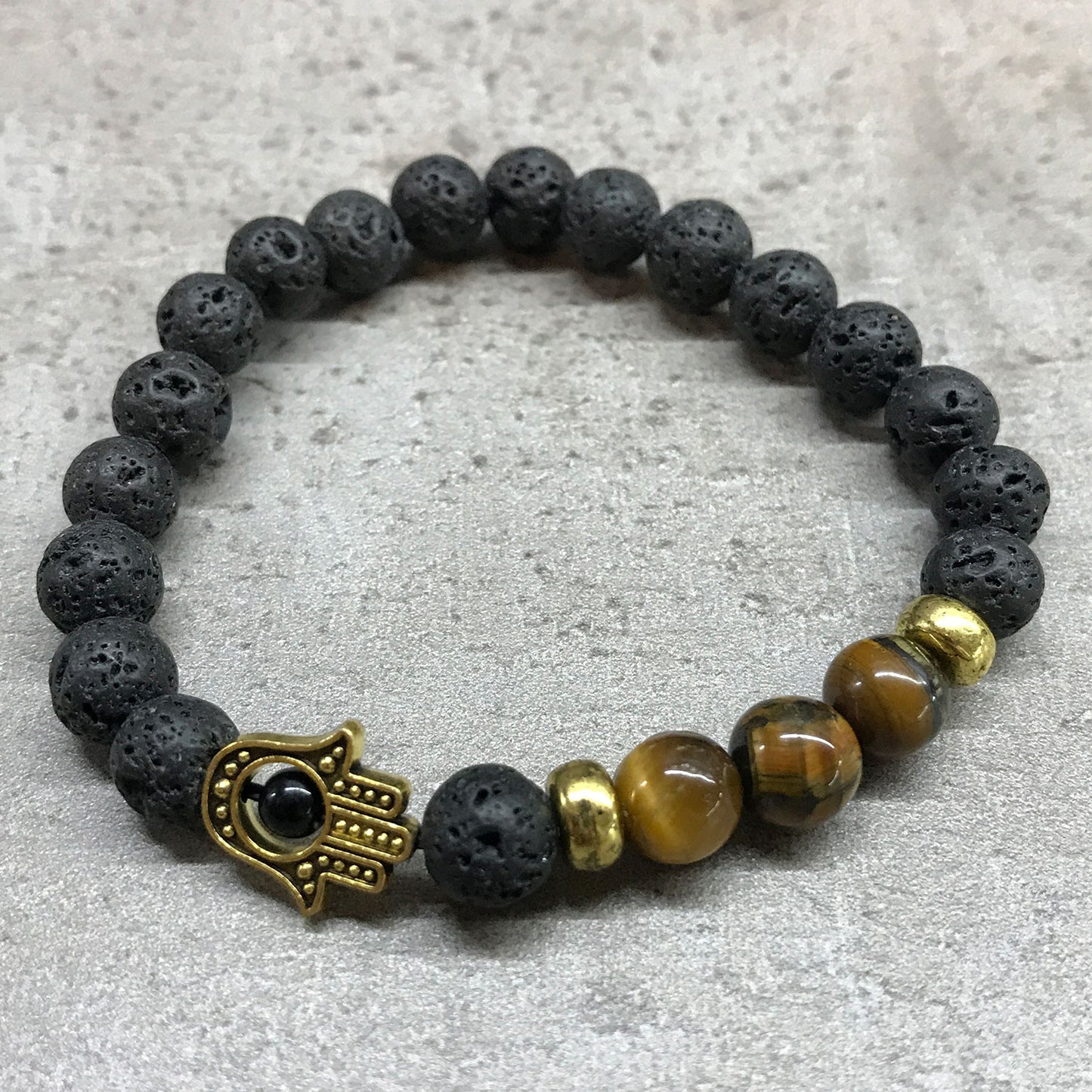 Lavastein-Armband – Hamsa – Tigerauge