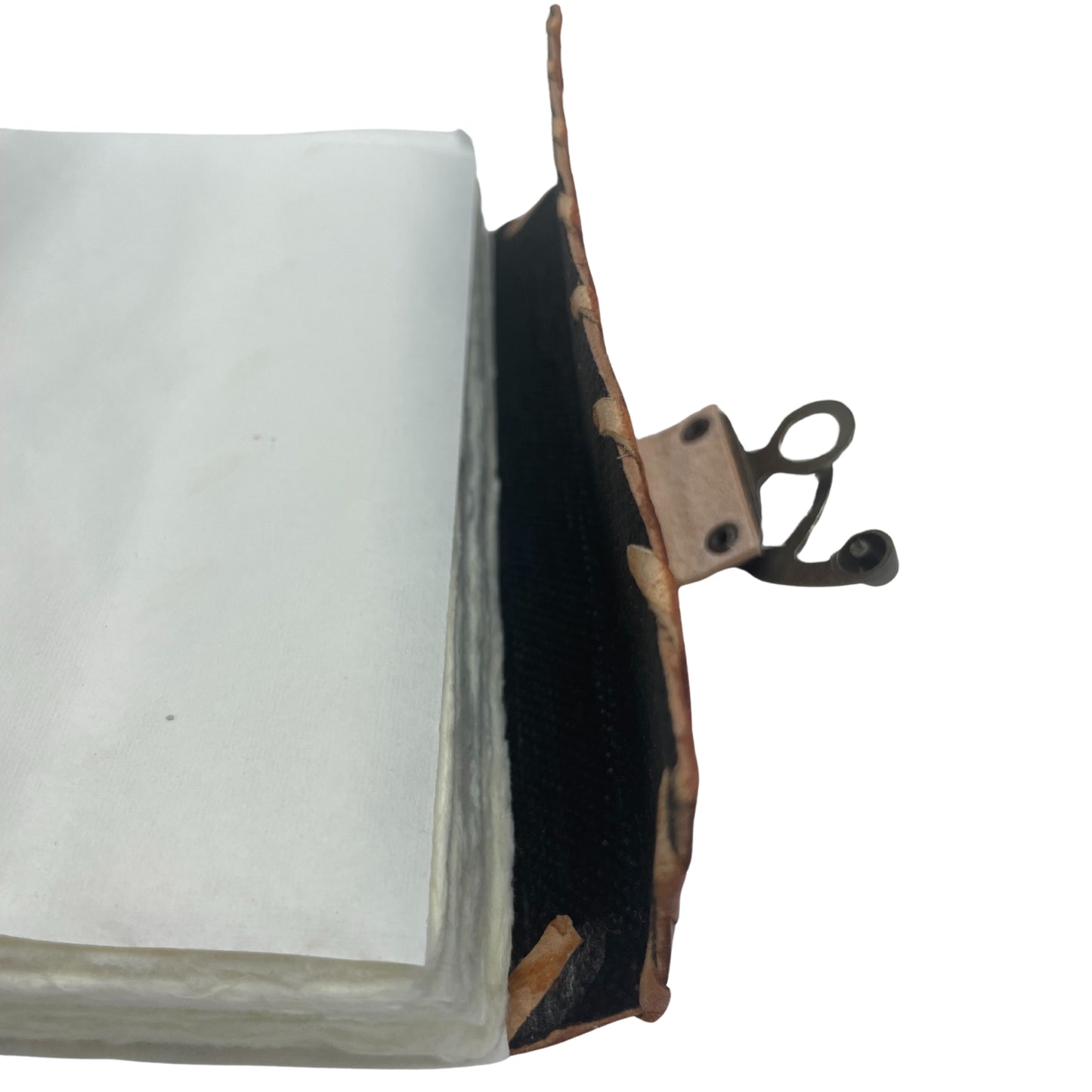 Carnet de notes marron clair avec bords usés et motif mauvais œil