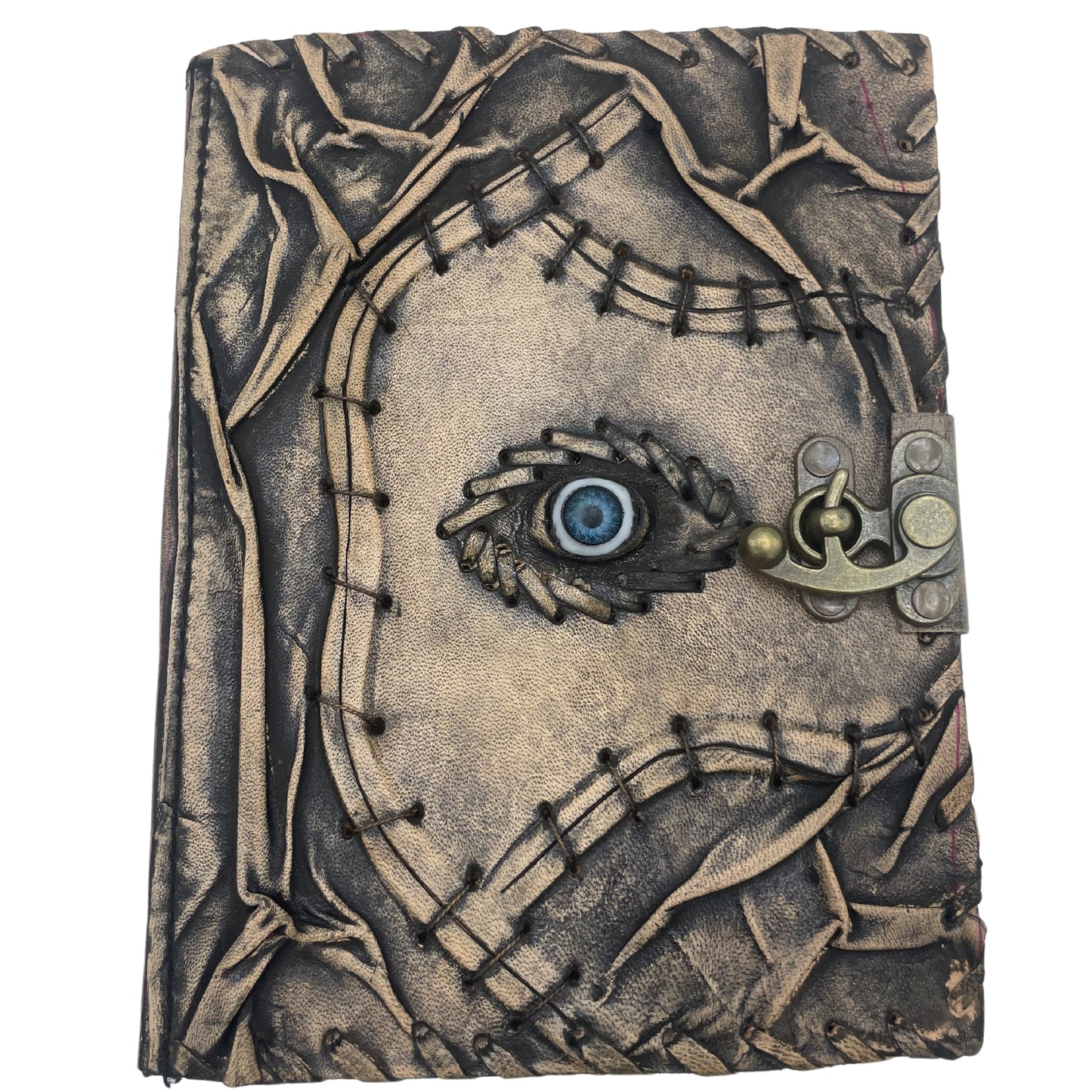 Carnet marron avec bords usés et motif mauvais œil